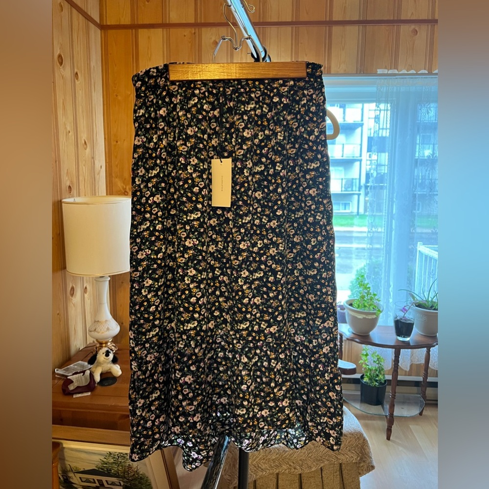 Halston skirt brand new with tag. Lined, flowy, midi length.